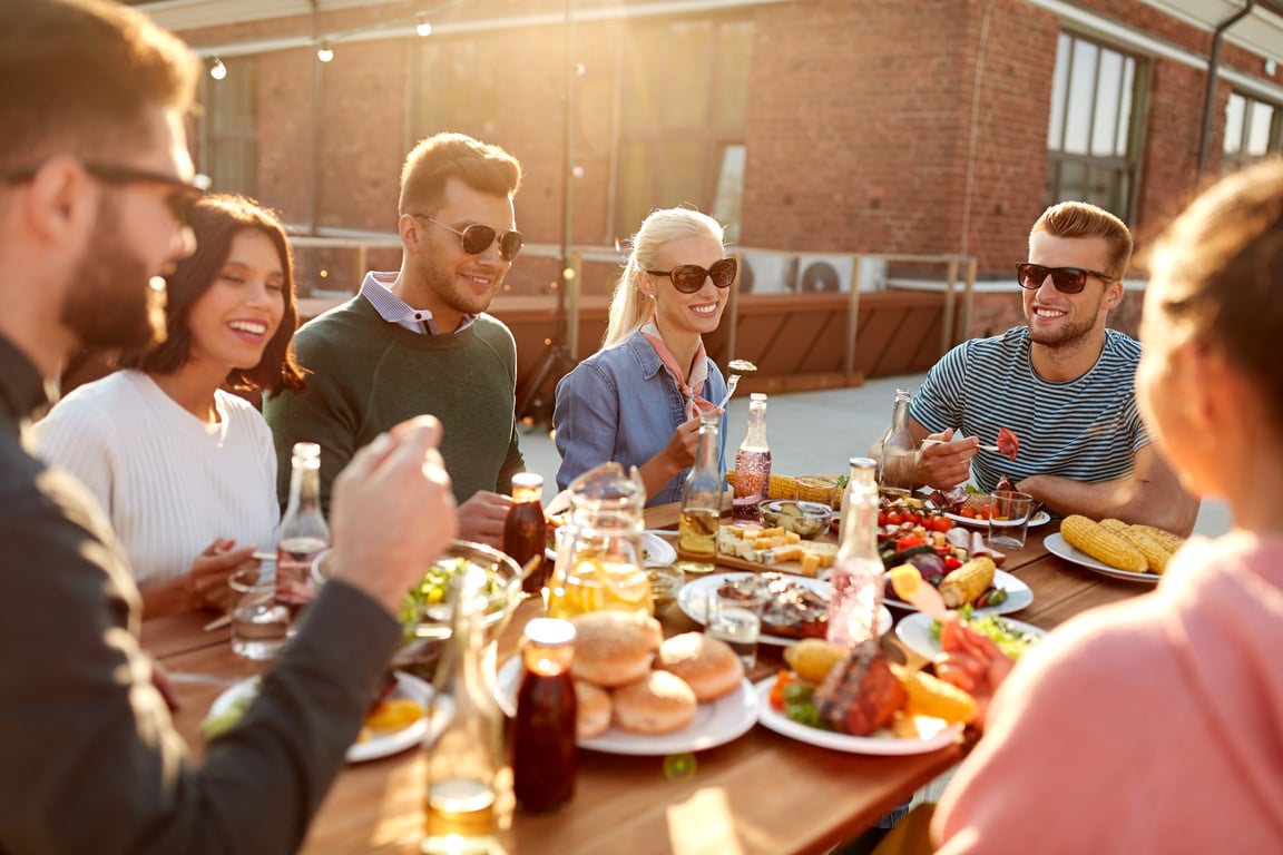 Friends Having Dinner or Bbq Party on Rooftop